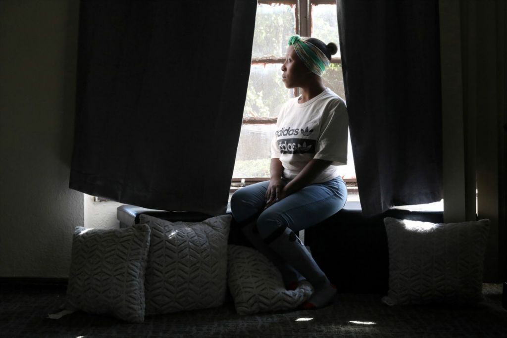 Award of Excellence, Portrait Personality - Amy E. Voigt / The Blade, “Scared Mother”Kytrell Brown sits in the window of her apartment in Toledo on October 8, 2020. Brown was evicted from LMHA public housing with her son Adryin Brown, 6, before the national eviction moratorium for the pandemic was put into place. Brown and her son were forced to couch surf until she was able to take over the lease for an apartment of one of her family members.  “I was embarrassed. I was hurt. I was scared because I didn’t have really nowhere to go. I was angry. I was afraid for my baby’s life. I was afraid for my life,” Ms. Brown said.